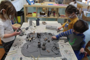 Early Childhood students exploring clay at The College School. 