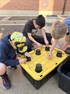 Students preparing the hydroponic tanks