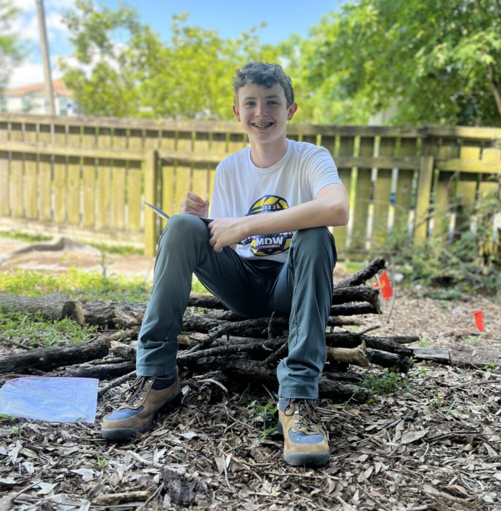 Student journaling after a day outside
